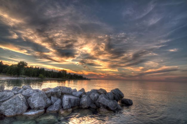 Gorgeous sunrise over mountain lake, the Blue Mountains, Canada. 