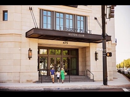 Family of three leaving Liberty Place Charleston by Hilton Club to explore Charleston, South Carolina. 