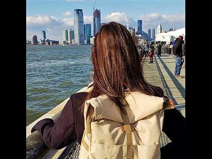 Hilton Grand Vacations Owner admiring the New York Harbor from The Battery in New York City. 