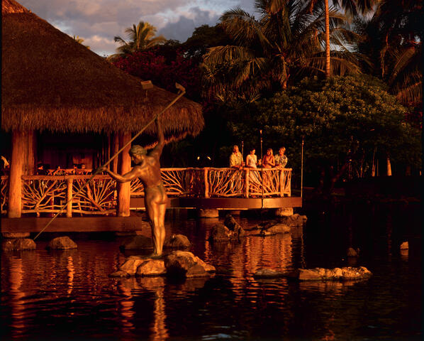 Group of people enjoying sunset overlooking ocean, Humuhumunukunukuapuaa, Grand Wailea Maui, a Waldorf Astoria  Resort, Hawaii. 