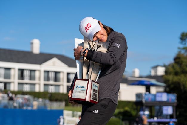 Hilton Grand Vacations Tournament of Champions winner Michelle Kang hugging trophy, Lake Nona Golf & Country Club, Florida. 