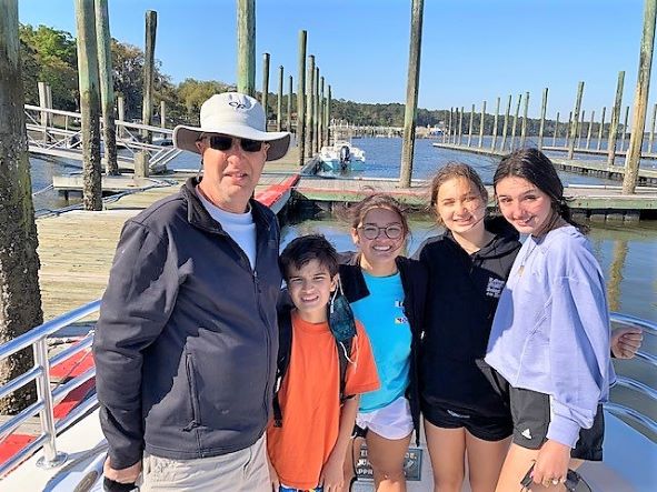 Hilton Grand Vacations Owner posing for picture on family vacation, Hilton Head Island, South Carolina. 