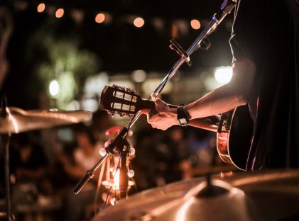 A band plays live music at a small venue