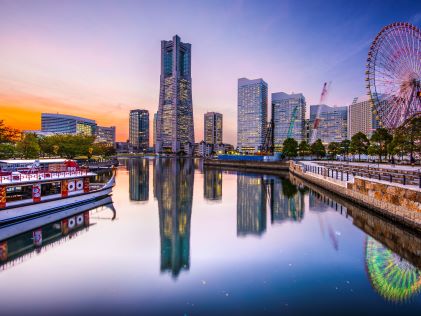 Waterfront view of Tokyo skyline from the river at dusk